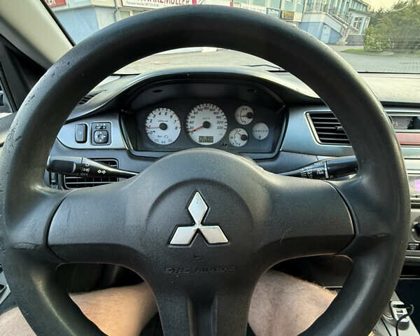 Чорний Міцубісі Lancer, об'ємом двигуна 1.6 л та пробігом 313 тис. км за 3600 $, фото 21 на Automoto.ua