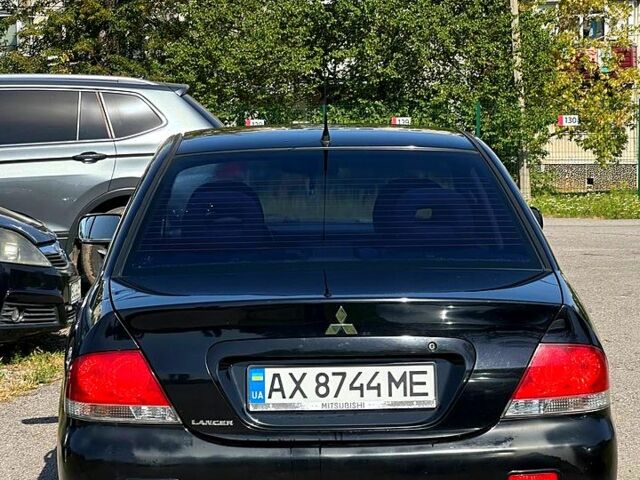 Черный Мицубиси Лансер, объемом двигателя 1.6 л и пробегом 230 тыс. км за 3200 $, фото 2 на Automoto.ua