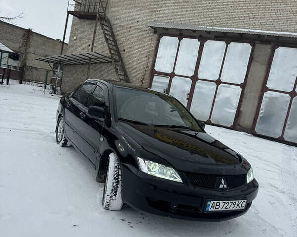 Чорний Міцубісі Lancer, об'ємом двигуна 1.58 л та пробігом 340 тис. км за 3550 $, фото 13 на Automoto.ua