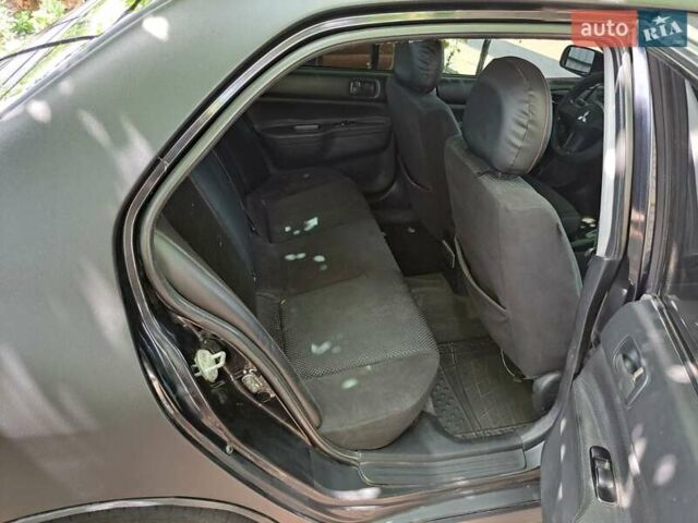 Чорний Міцубісі Lancer, об'ємом двигуна 1.58 л та пробігом 280 тис. км за 3950 $, фото 20 на Automoto.ua