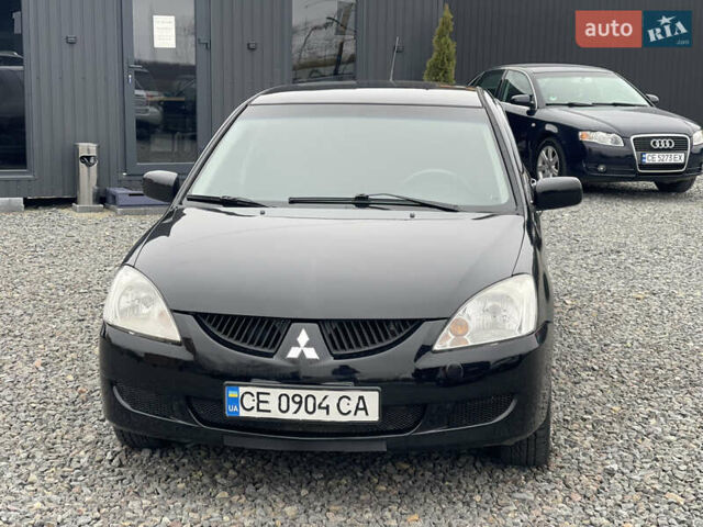 Чорний Міцубісі Lancer, об'ємом двигуна 1.58 л та пробігом 230 тис. км за 3350 $, фото 1 на Automoto.ua