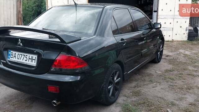Чорний Міцубісі Lancer, об'ємом двигуна 1.59 л та пробігом 185 тис. км за 4900 $, фото 8 на Automoto.ua