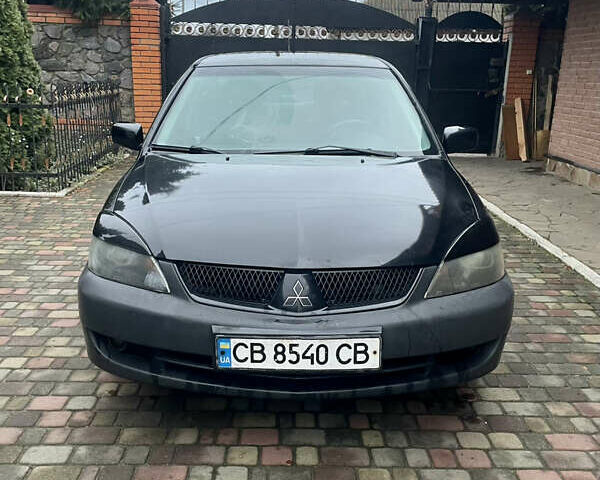 Чорний Міцубісі Lancer, об'ємом двигуна 1.59 л та пробігом 305 тис. км за 2950 $, фото 10 на Automoto.ua