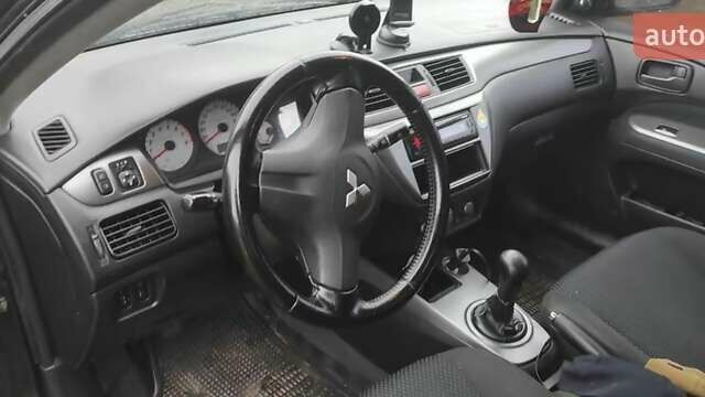 Чорний Міцубісі Lancer, об'ємом двигуна 1.58 л та пробігом 140 тис. км за 2999 $, фото 4 на Automoto.ua