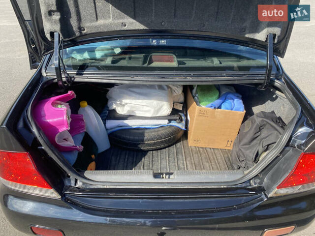Чорний Міцубісі Lancer, об'ємом двигуна 1.58 л та пробігом 236 тис. км за 4500 $, фото 13 на Automoto.ua