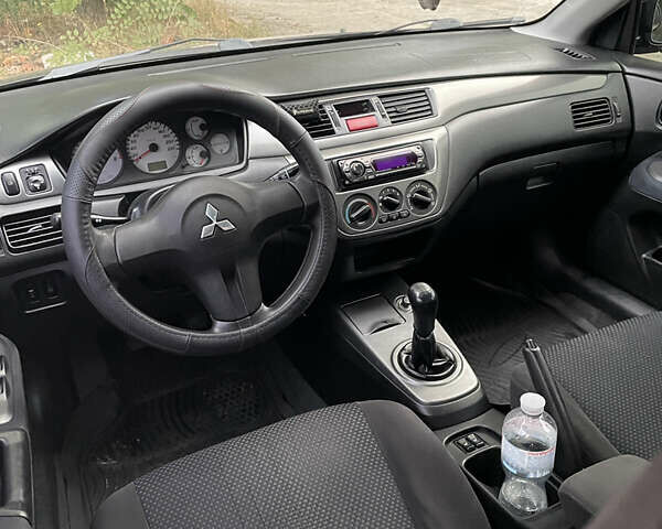 Чорний Міцубісі Lancer, об'ємом двигуна 1.6 л та пробігом 240 тис. км за 4599 $, фото 9 на Automoto.ua