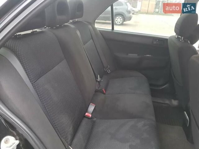 Чорний Міцубісі Lancer, об'ємом двигуна 1.58 л та пробігом 290 тис. км за 3200 $, фото 15 на Automoto.ua