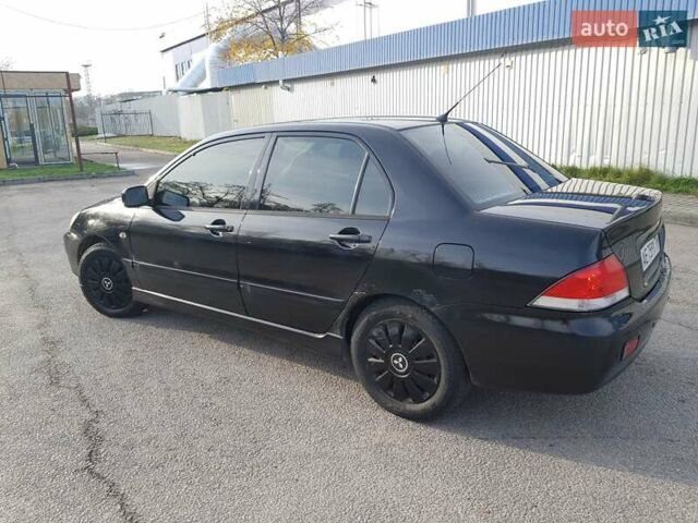 Чорний Міцубісі Lancer, об'ємом двигуна 1.58 л та пробігом 290 тис. км за 3200 $, фото 4 на Automoto.ua