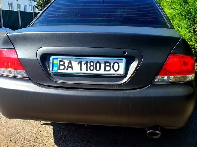 Чорний Міцубісі Lancer, об'ємом двигуна 1.6 л та пробігом 211 тис. км за 3500 $, фото 4 на Automoto.ua