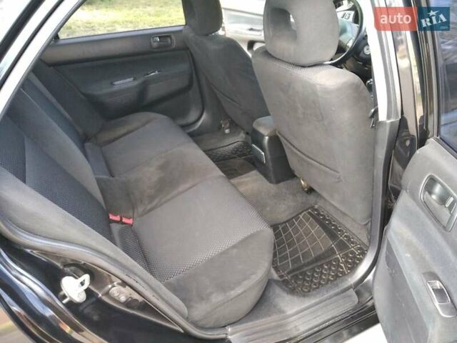 Чорний Міцубісі Lancer, об'ємом двигуна 1.58 л та пробігом 520 тис. км за 3400 $, фото 12 на Automoto.ua