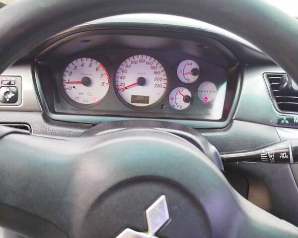 Чорний Міцубісі Lancer, об'ємом двигуна 1.6 л та пробігом 245 тис. км за 4000 $, фото 9 на Automoto.ua
