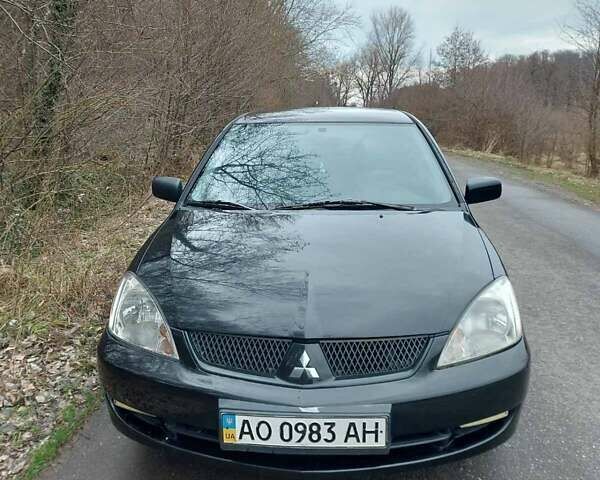 Чорний Міцубісі Lancer, об'ємом двигуна 1.58 л та пробігом 202 тис. км за 4100 $, фото 16 на Automoto.ua