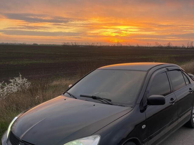 Черный Мицубиси Лансер, объемом двигателя 1.6 л и пробегом 270 тыс. км за 3953 $, фото 16 на Automoto.ua