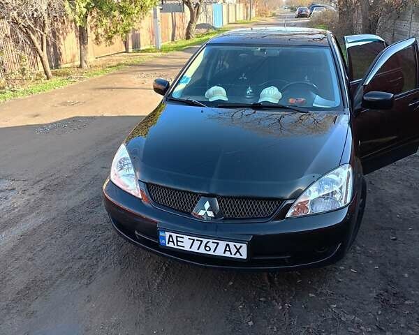 Чорний Міцубісі Lancer, об'ємом двигуна 1.6 л та пробігом 240 тис. км за 5400 $, фото 4 на Automoto.ua