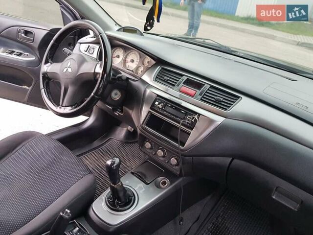 Чорний Міцубісі Lancer, об'ємом двигуна 1.58 л та пробігом 290 тис. км за 3200 $, фото 12 на Automoto.ua