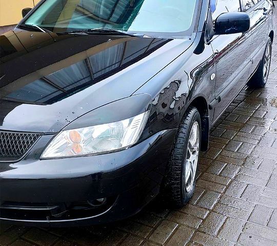 Чорний Міцубісі Lancer, об'ємом двигуна 1.6 л та пробігом 294 тис. км за 4400 $, фото 4 на Automoto.ua