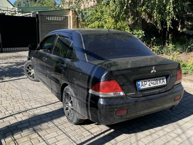 Чорний Міцубісі Lancer, об'ємом двигуна 1.6 л та пробігом 300 тис. км за 4200 $, фото 2 на Automoto.ua