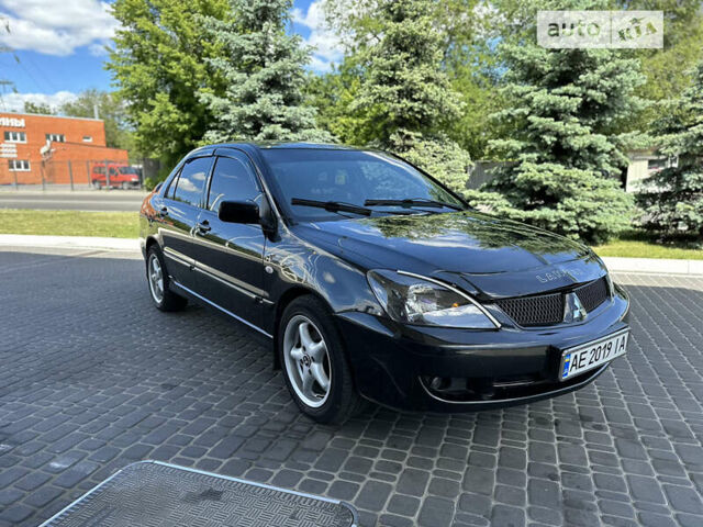 Чорний Міцубісі Lancer, об'ємом двигуна 1.58 л та пробігом 223 тис. км за 4400 $, фото 1 на Automoto.ua