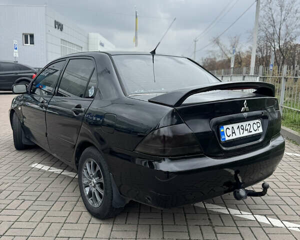 Черный Мицубиси Лансер, объемом двигателя 1.58 л и пробегом 370 тыс. км за 3500 $, фото 3 на Automoto.ua