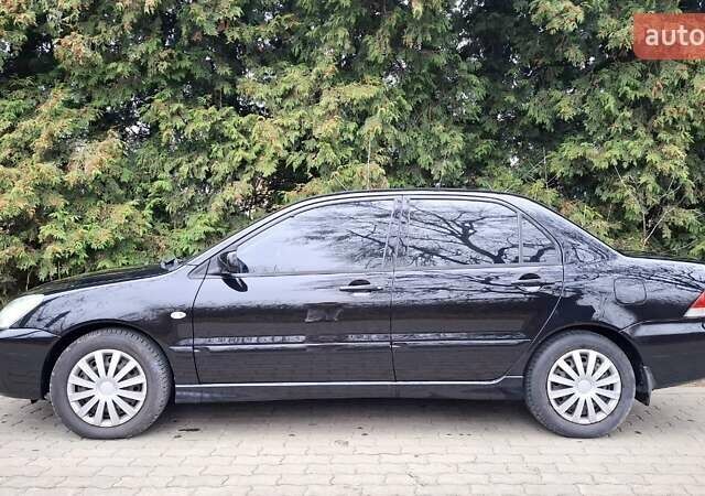 Черный Мицубиси Лансер, объемом двигателя 1.58 л и пробегом 246 тыс. км за 4200 $, фото 2 на Automoto.ua