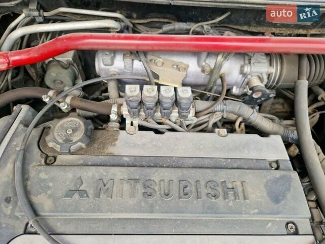 Черный Мицубиси Лансер, объемом двигателя 2 л и пробегом 168 тыс. км за 4999 $, фото 13 на Automoto.ua