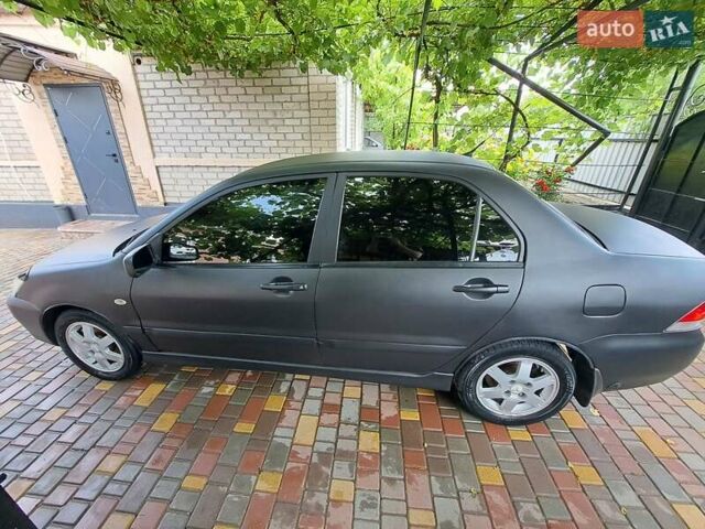 Чорний Міцубісі Lancer, об'ємом двигуна 1.58 л та пробігом 280 тис. км за 3950 $, фото 9 на Automoto.ua
