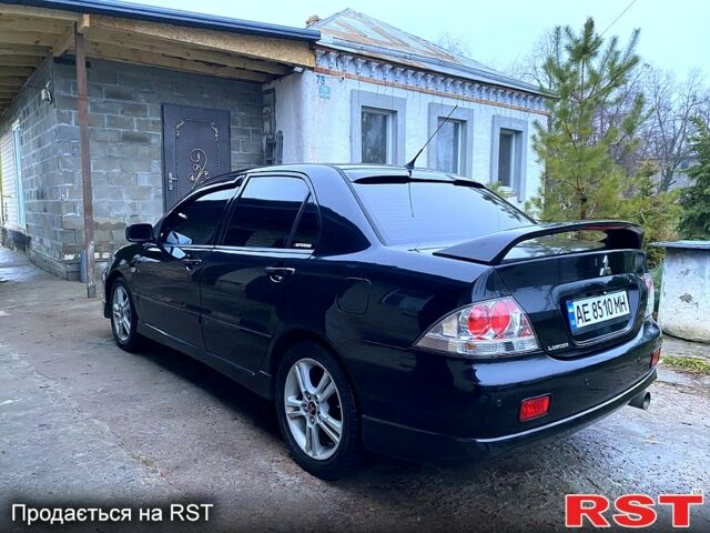 Чорний Міцубісі Lancer, об'ємом двигуна 2 л та пробігом 347 тис. км за 5200 $, фото 2 на Automoto.ua