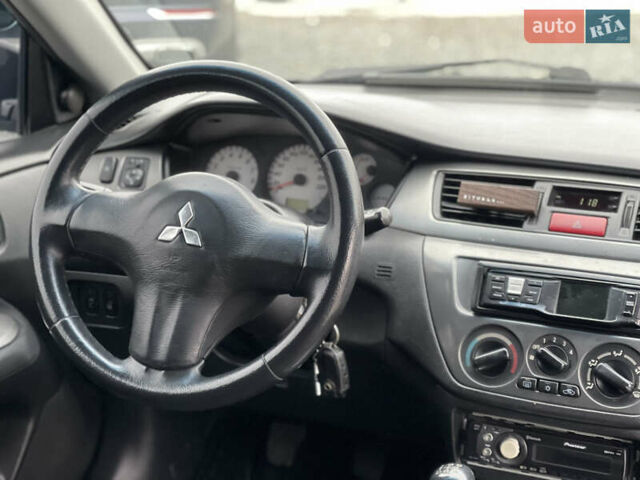Чорний Міцубісі Lancer, об'ємом двигуна 1.58 л та пробігом 230 тис. км за 3350 $, фото 17 на Automoto.ua