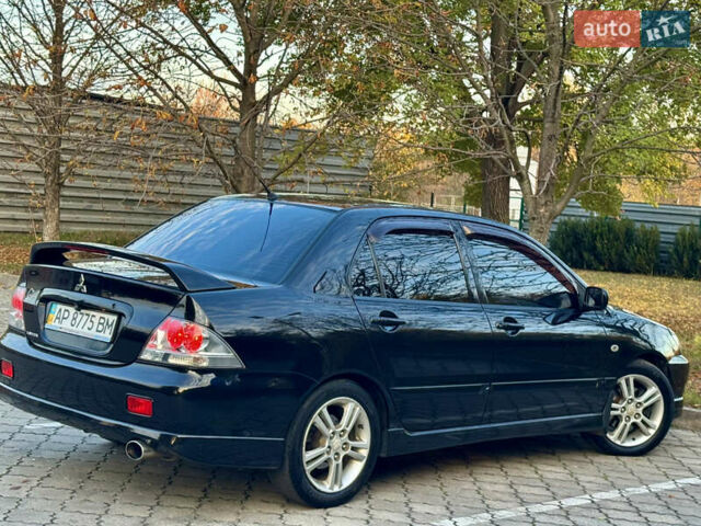 Міцубісі Lancer 2006 у Дніпро (Дніпропетровську) на Automoto.ua Чорний Міцубісі Lancer, об'ємом двигуна 2 л та пробігом 230 тис. км за 4900 $, фото 12 на Automoto.ua