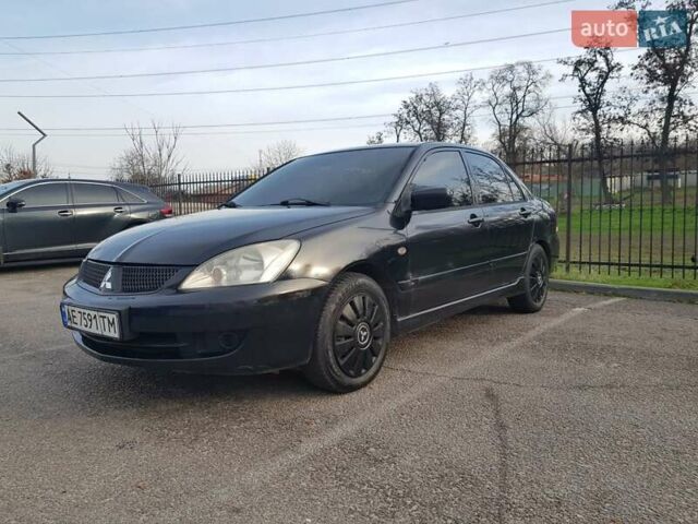 Чорний Міцубісі Lancer, об'ємом двигуна 1.58 л та пробігом 290 тис. км за 3200 $, фото 9 на Automoto.ua