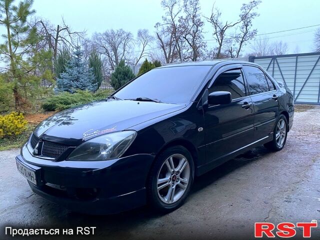 Чорний Міцубісі Lancer, об'ємом двигуна 2 л та пробігом 347 тис. км за 5200 $, фото 3 на Automoto.ua