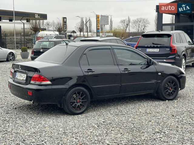 Чорний Міцубісі Lancer, об'ємом двигуна 1.58 л та пробігом 230 тис. км за 3350 $, фото 7 на Automoto.ua