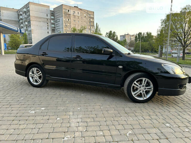 Чорний Міцубісі Lancer, об'ємом двигуна 2 л та пробігом 190 тис. км за 6400 $, фото 2 на Automoto.ua