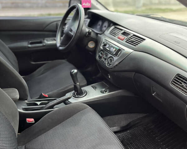 Чорний Міцубісі Lancer, об'ємом двигуна 1.58 л та пробігом 230 тис. км за 3350 $, фото 7 на Automoto.ua