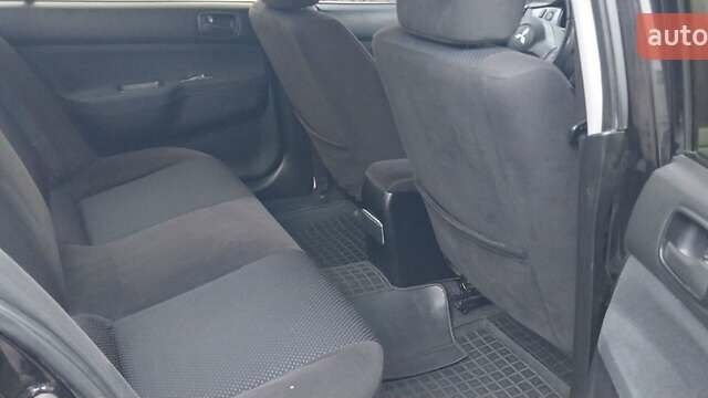 Чорний Міцубісі Lancer, об'ємом двигуна 1.59 л та пробігом 185 тис. км за 4900 $, фото 1 на Automoto.ua