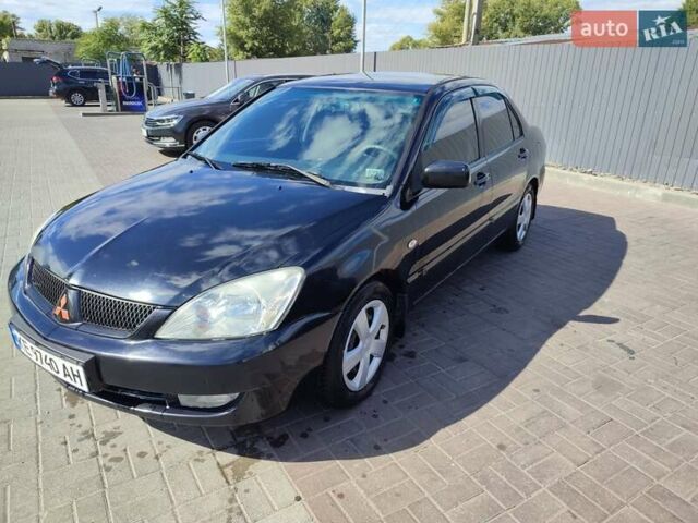Чорний Міцубісі Lancer, об'ємом двигуна 1.58 л та пробігом 128 тис. км за 4600 $, фото 9 на Automoto.ua