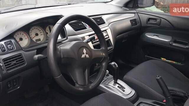 Чорний Міцубісі Lancer, об'ємом двигуна 1.59 л та пробігом 185 тис. км за 4900 $, фото 2 на Automoto.ua