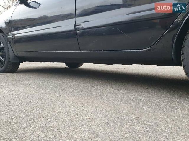 Черный Мицубиси Лансер, объемом двигателя 1.58 л и пробегом 222 тыс. км за 2999 $, фото 12 на Automoto.ua