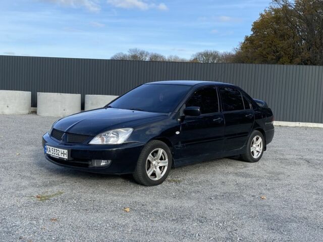 Черный Мицубиси Лансер, объемом двигателя 1.6 л и пробегом 200 тыс. км за 3400 $, фото 1 на Automoto.ua