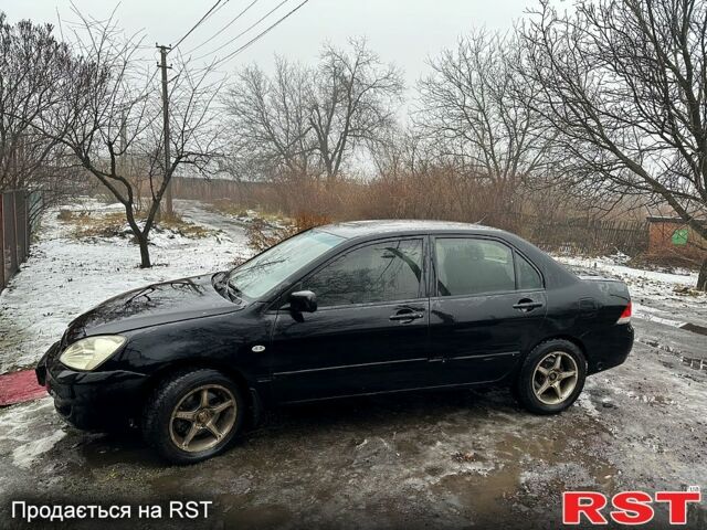 Чорний Міцубісі Lancer, об'ємом двигуна 1.6 л та пробігом 213 тис. км за 4000 $, фото 3 на Automoto.ua