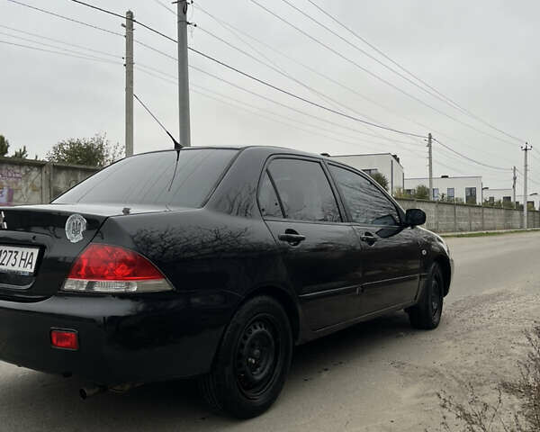 Чорний Міцубісі Lancer, об'ємом двигуна 1.58 л та пробігом 230 тис. км за 3350 $, фото 4 на Automoto.ua
