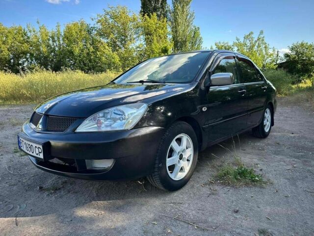 Черный Мицубиси Лансер, объемом двигателя 1.6 л и пробегом 289 тыс. км за 3200 $, фото 15 на Automoto.ua