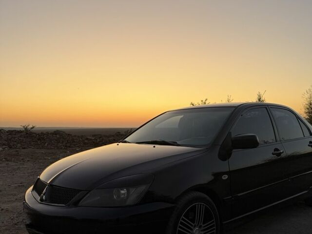 Чорний Міцубісі Lancer, об'ємом двигуна 2 л та пробігом 300 тис. км за 4100 $, фото 1 на Automoto.ua