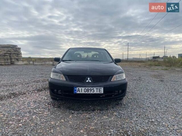 Чорний Міцубісі Lancer, об'ємом двигуна 1.6 л та пробігом 335 тис. км за 3500 $, фото 1 на Automoto.ua