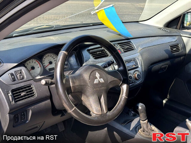 Черный Мицубиси Лансер, объемом двигателя 1.6 л и пробегом 300 тыс. км за 3599 $, фото 9 на Automoto.ua