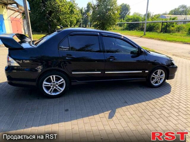 Чорний Міцубісі Lancer, об'ємом двигуна 2 л та пробігом 240 тис. км за 5600 $, фото 1 на Automoto.ua