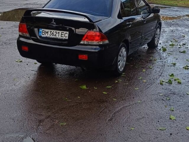 Чорний Міцубісі Lancer, об'ємом двигуна 1.6 л та пробігом 250 тис. км за 4000 $, фото 4 на Automoto.ua