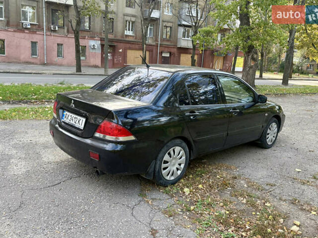 Черный Мицубиси Лансер, объемом двигателя 1.59 л и пробегом 286 тыс. км за 3700 $, фото 3 на Automoto.ua