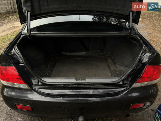 Чорний Міцубісі Lancer, об'ємом двигуна 1.58 л та пробігом 210 тис. км за 3900 $, фото 16 на Automoto.ua