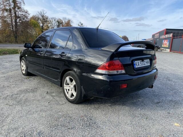 Черный Мицубиси Лансер, объемом двигателя 1.6 л и пробегом 200 тыс. км за 3400 $, фото 3 на Automoto.ua